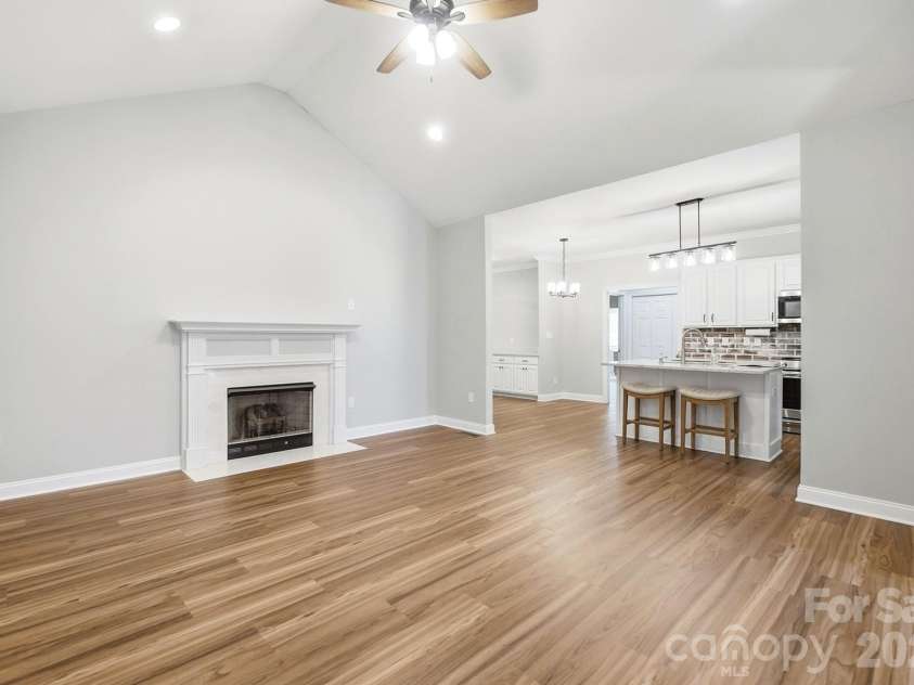 2301 Hunter Davis Court, Monroe, NC 28110.  MLS# CAR4428195, YatesRealty ID 55627. Great room looking into the kitchen and breakfast area.