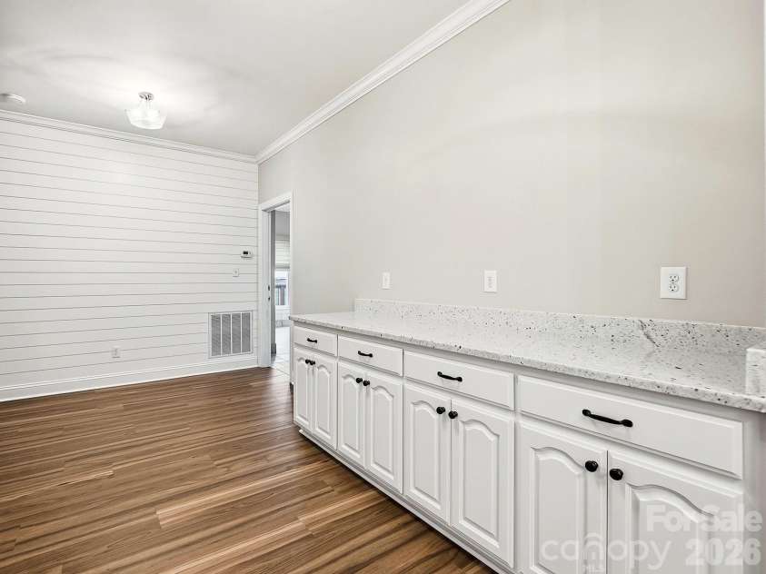 2301 Hunter Davis Court, Monroe, NC 28110.  MLS# CAR4428195, YatesRealty ID 55627. Ship lap adds character to this butler/buffet area, with extra storage or use it to fold clothes... multiple purposes for this extra large hall opposite the washer and dryer
