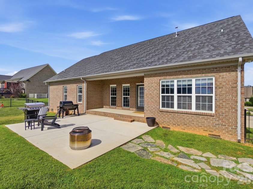 4004 Camden Oaks Lane, Monroe, NC 28110.  MLS# CAR4428200, YatesRealty ID 55628. Covered Porch and Extended Patio for Entertaining