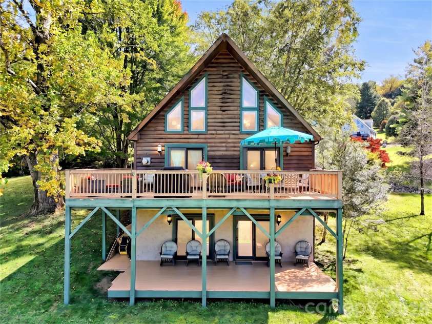 206 Sams Trail, Waynesville, NC 28786.  MLS# CAR4433077, YatesRealty ID 55642. Chalet style home