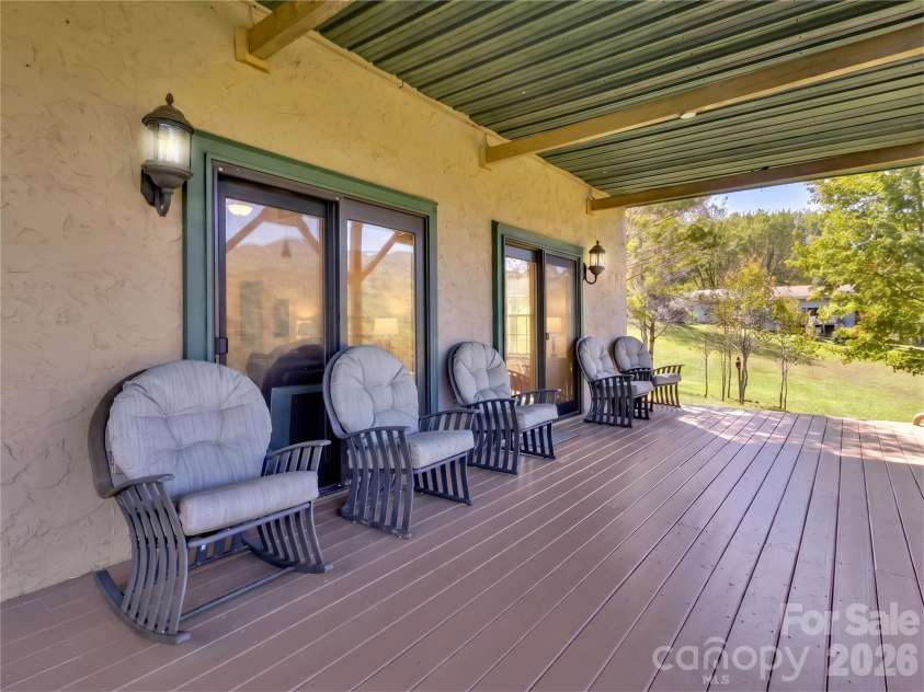 206 Sams Trail, Waynesville, NC 28786.  MLS# CAR4433077, YatesRealty ID 55642. Great covered deck to enjoy beautiful mtn views