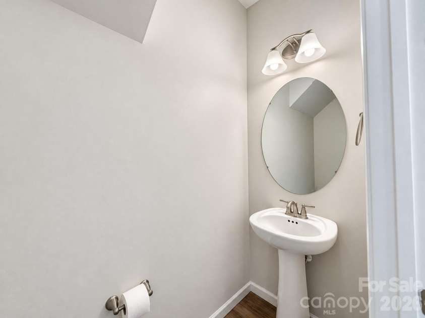 8149 Merryvale Lane, Charlotte, NC 28214.  MLS# CAR4432571, YatesRealty ID 55655. Half bath on the main floor.