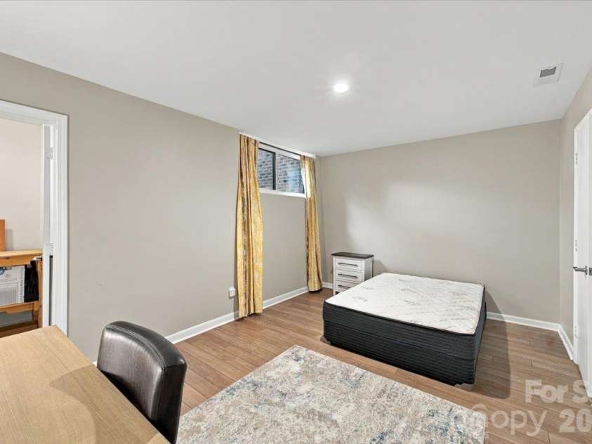 5805 Sharon Road, Charlotte, NC 28210.  MLS# CAR4432363, YatesRealty ID 55662. Basement level bedroom with ensuite and ample closet and storage space.