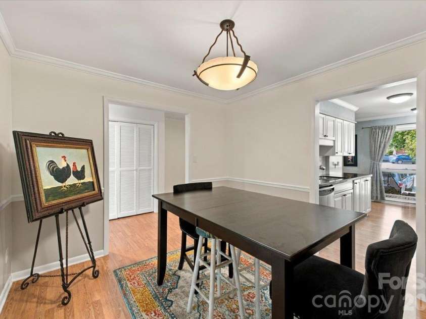 5805 Sharon Road, Charlotte, NC 28210.  MLS# CAR4432363, YatesRealty ID 55662. Dining room between kitchen and living room on main
