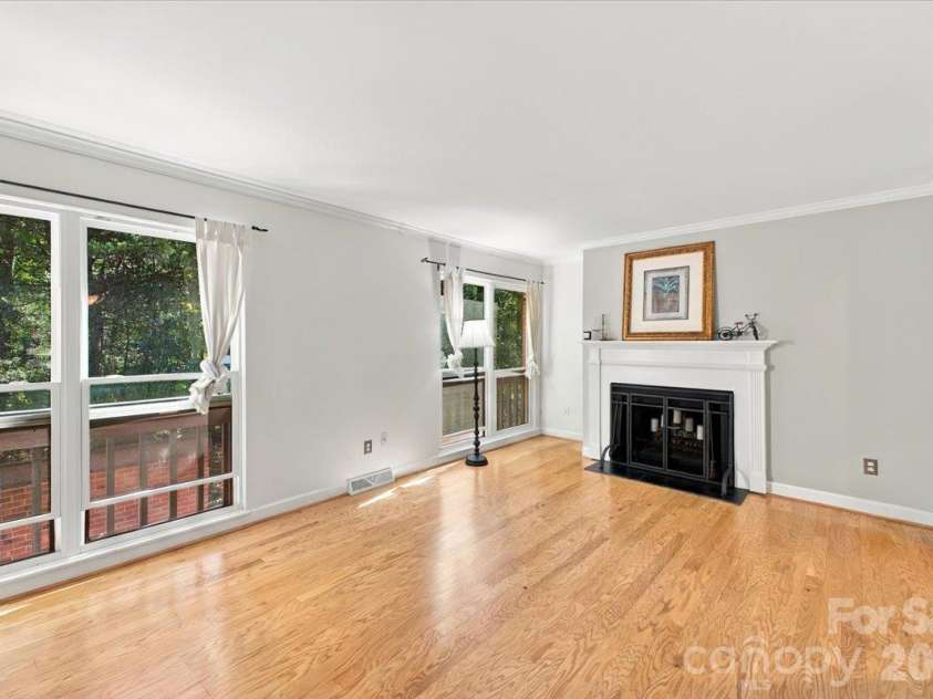 5805 Sharon Road, Charlotte, NC 28210.  MLS# CAR4432363, YatesRealty ID 55662. Living room with fireplace on main level