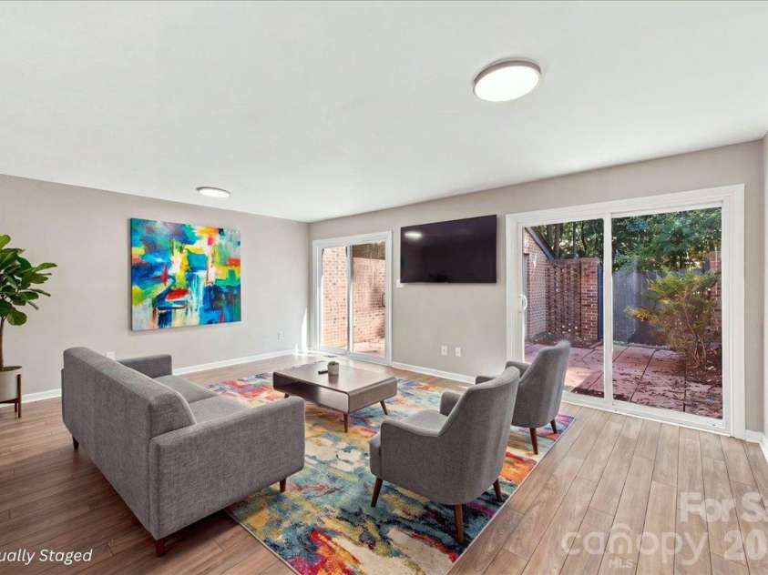 5805 Sharon Road, Charlotte, NC 28210.  MLS# CAR4432363, YatesRealty ID 55662. (virtually staged) Basement level with open concept living space and bedroom with ensuite
