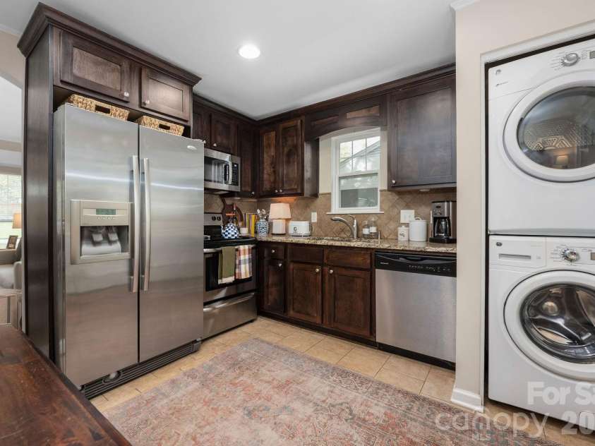 4805 Murrayhill Road, Charlotte, NC 28209.  MLS# CAR4431947, YatesRealty ID 55669. Kitchen and stacked laundry