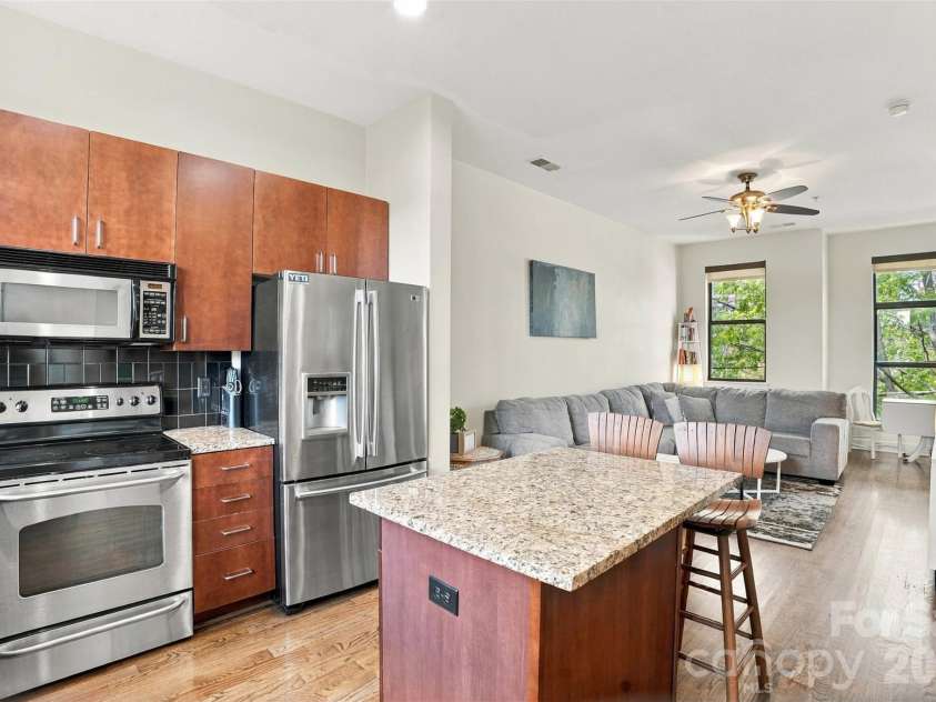 534 McDowell Street, Charlotte, NC 28204.  MLS# CAR4431540, YatesRealty ID 55682. Kitchen flows into living room