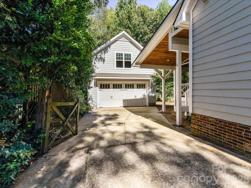 10709 Danesway Lane, Cornelius, NC 28031.  MLS# CAR4431451, YatesRealty ID 55685. The detached two-car garage features unfinished overhead space that can easily be finished for a garage apartment.