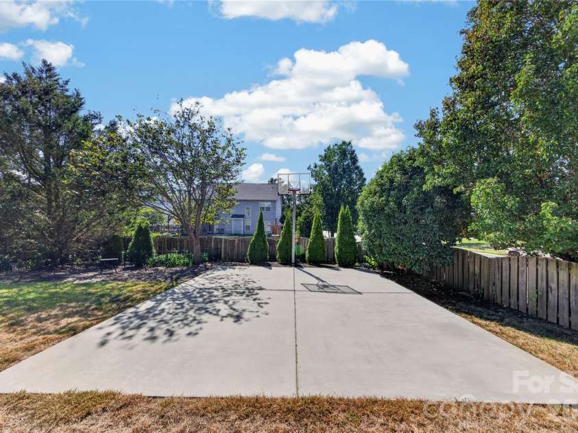 5725 Lindley Crescent Drive, Indian Trail, NC 28079.  MLS# CAR4431412, YatesRealty ID 55691. Concrete basketball pad with installed hoop