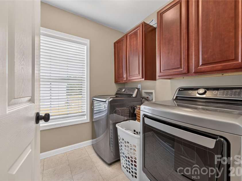 5725 Lindley Crescent Drive, Indian Trail, NC 28079.  MLS# CAR4431412, YatesRealty ID 55691. Laundry room with cabinetry for storage