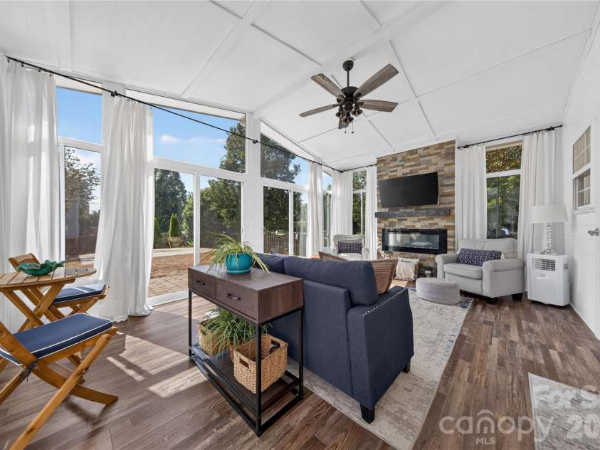 5725 Lindley Crescent Drive, Indian Trail, NC 28079.  MLS# CAR4431412, YatesRealty ID 55691. Sunroom overlooking fully fenced backyard with vaulted ceilings and electric fireplace