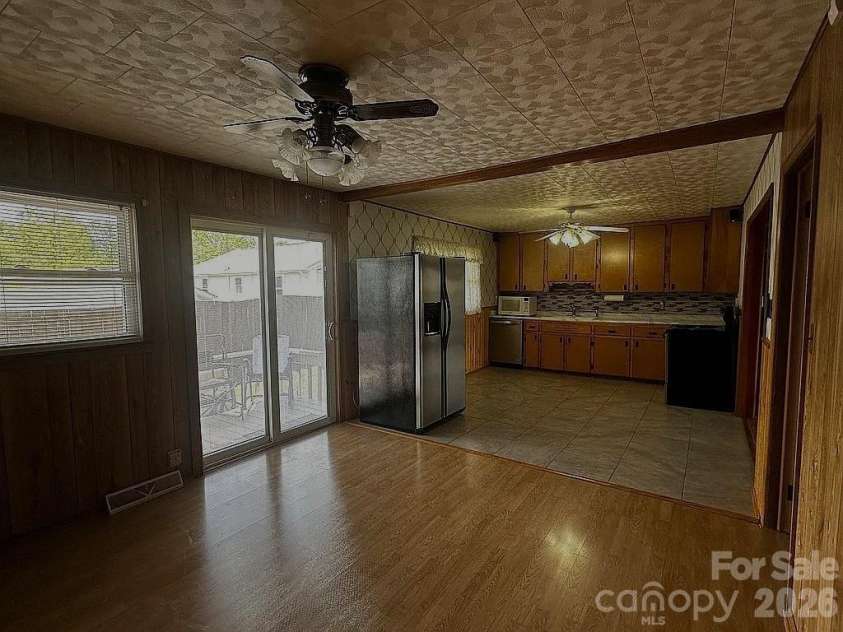 34 Sunset Drive, Brevard, NC 28712.  MLS# CAR4358442, YatesRealty ID 5570. Dining to Rear Deck