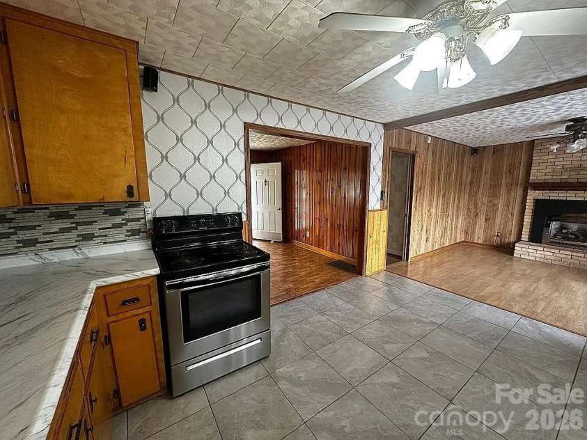 34 Sunset Drive, Brevard, NC 28712.  MLS# CAR4358442, YatesRealty ID 5570. Kitchen to Formal Dining