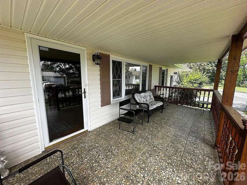 34 Sunset Drive, Brevard, NC 28712.  MLS# CAR4358442, YatesRealty ID 5570. Rocking Chair Front Porch