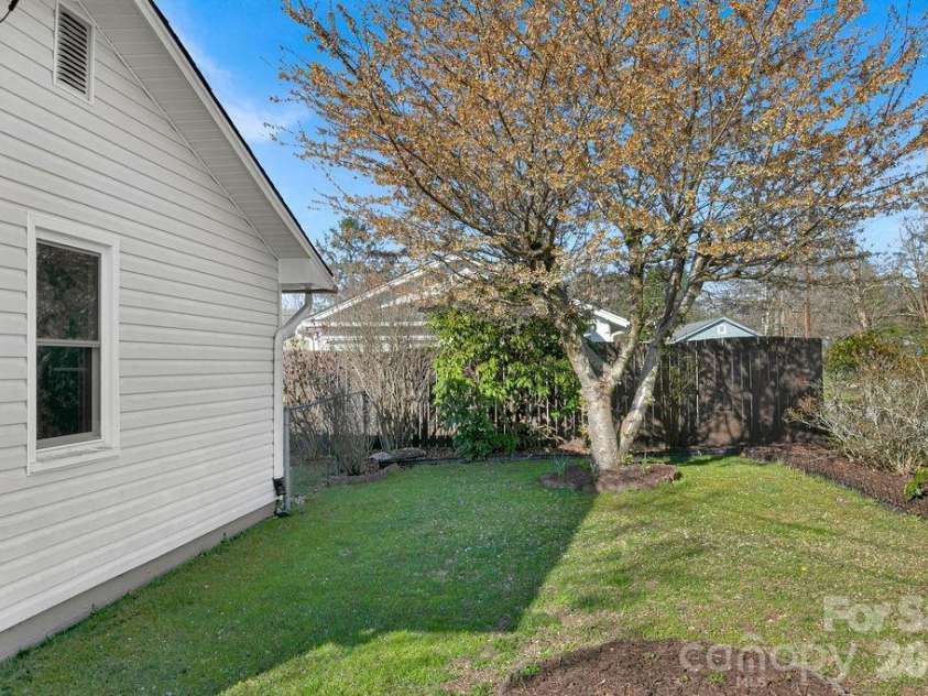 34 Sunset Drive, Brevard, NC 28712.  MLS# CAR4358442, YatesRealty ID 5570. Side Yard