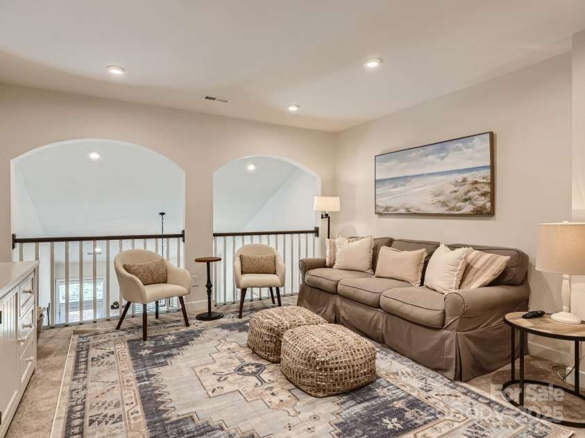 125 Lanyard Drive, Mooresville, NC 28117.  MLS# CAR4234396, YatesRealty ID 5571. Huge upstairs loft / flex room has beautiful architectural arches. It has added recessed lights and gets lots of natural light.