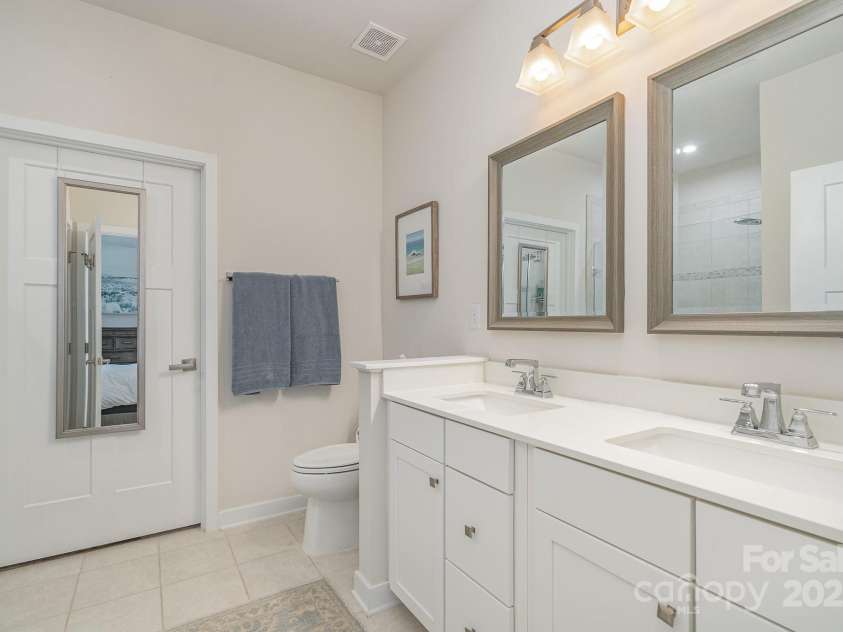 125 Lanyard Drive, Mooresville, NC 28117.  MLS# CAR4234396, YatesRealty ID 5571. Quartz counters and double vanity in ensuite bathroom.