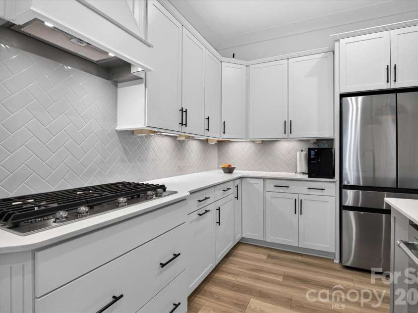 1216 Glade Arch Lane, Huntersville, NC 28078.  MLS# CAR4429661, YatesRealty ID 55720. Herringbone backsplash that makes even weeknight cooking feel like a moment. This kitchen was built to be used.