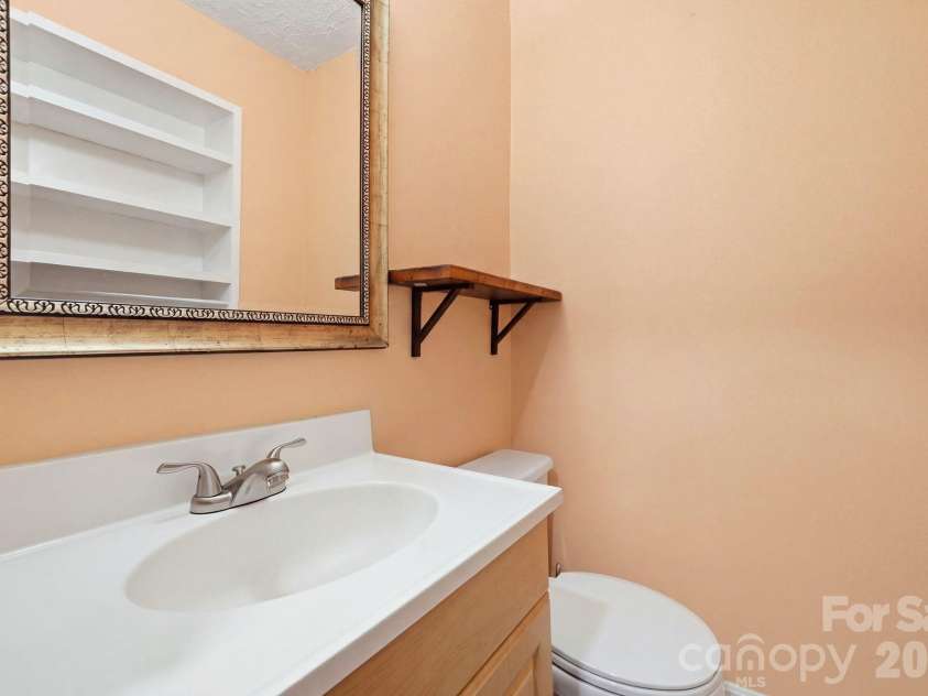 1524 Lanewood Place, Charlotte, NC 28208.  MLS# CAR4429696, YatesRealty ID 55721. Half Bath In Primary Bedroom