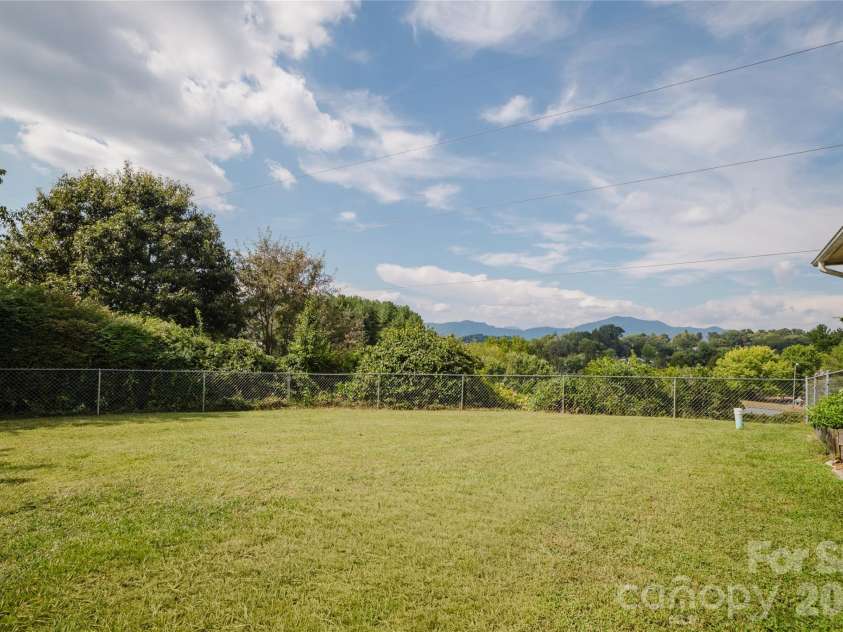 91 Crestview Street, Canton, NC 28716.  MLS# CAR4429307, YatesRealty ID 55727. View from the fully fenced in back yard