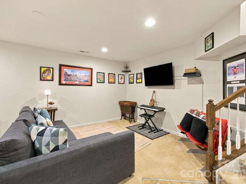 409 Armour Street, Davidson, NC 28036.  MLS# CAR4426934, YatesRealty ID 55738. Finished basement 3rd bedroom