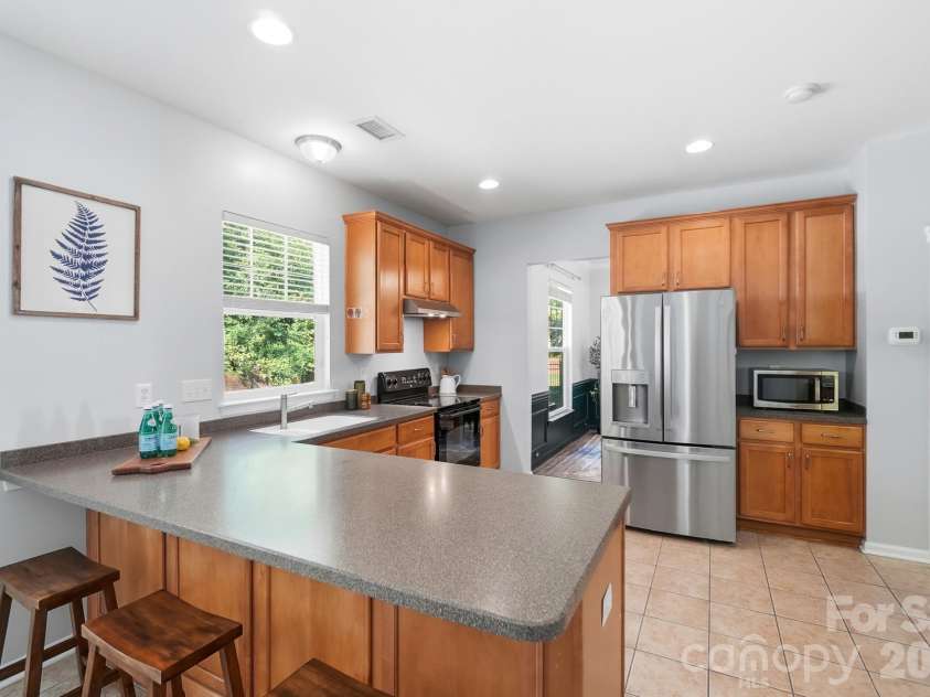 10329 Misty Moss Court, Mint Hill, NC 28227.  MLS# CAR4431248, YatesRealty ID 55756. Kitchen with Breakfast Bar