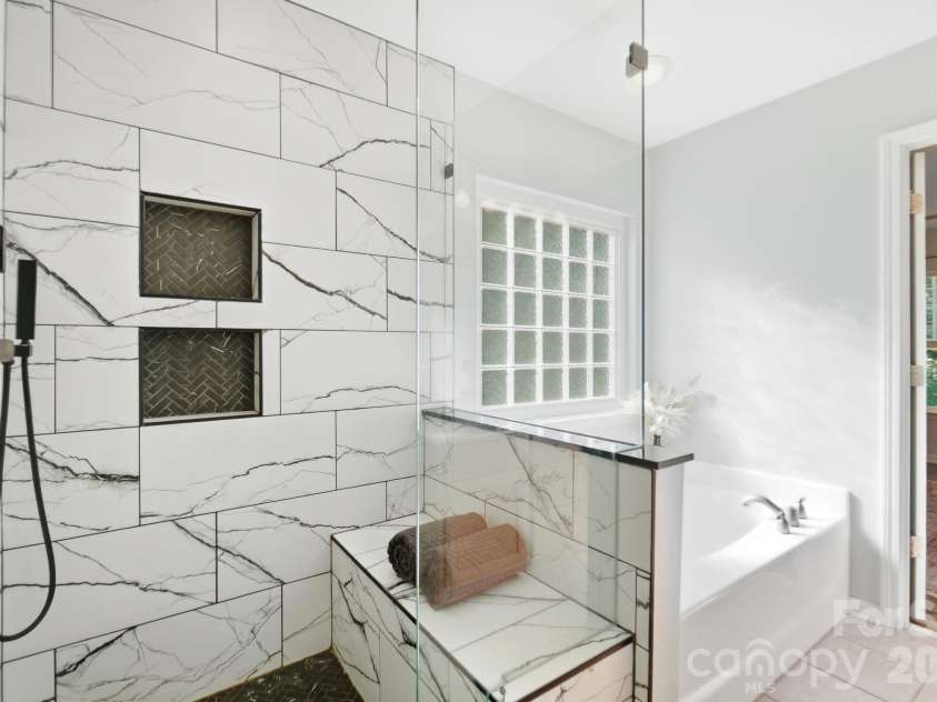 10329 Misty Moss Court, Mint Hill, NC 28227.  MLS# CAR4431248, YatesRealty ID 55756. Recently remodeled tiled shower