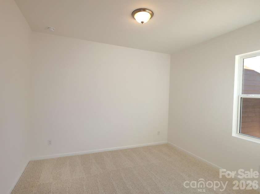 221 Amber Glen Drive, Locust, NC 28097.  MLS# CAR4351654, YatesRealty ID 5577. First floor bedroom