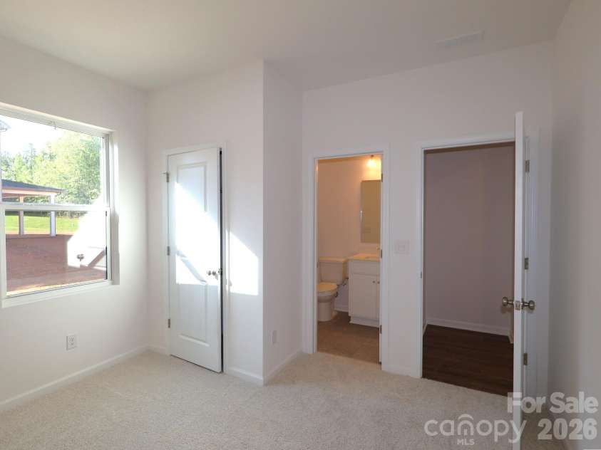 221 Amber Glen Drive, Locust, NC 28097.  MLS# CAR4351654, YatesRealty ID 5577. First floor bedroom