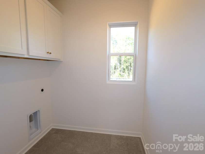 221 Amber Glen Drive, Locust, NC 28097.  MLS# CAR4351654, YatesRealty ID 5577. Laundry room