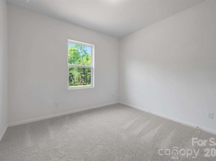 221 Amber Glen Drive, Locust, NC 28097.  MLS# CAR4351654, YatesRealty ID 5577. Secondary bedroom