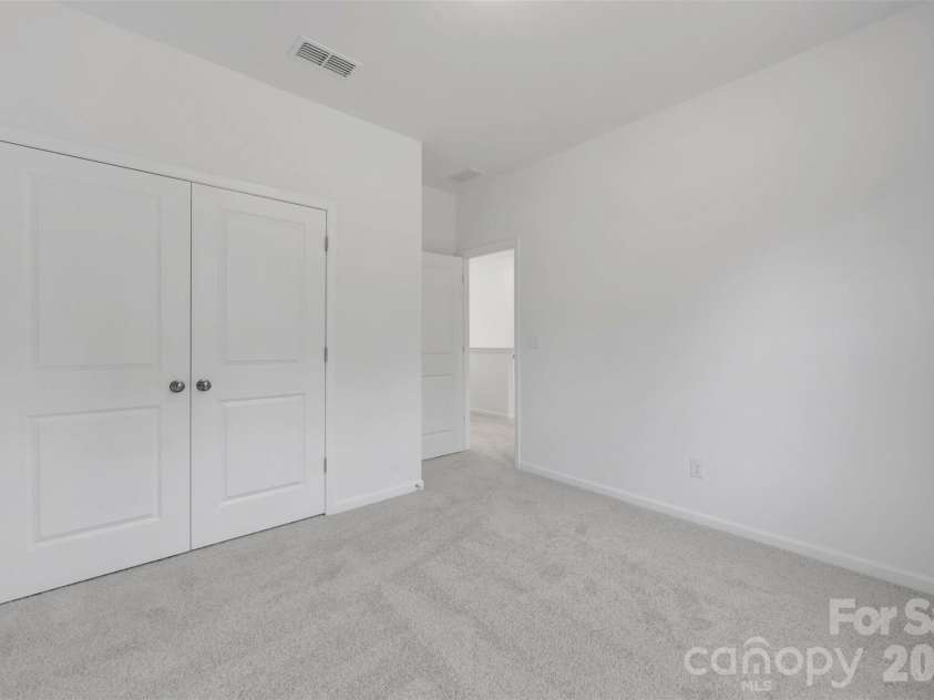 221 Amber Glen Drive, Locust, NC 28097.  MLS# CAR4351654, YatesRealty ID 5577. Secondary bedroom