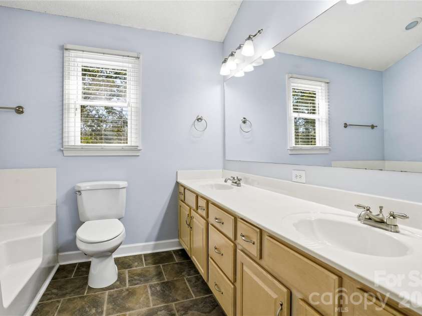 119 Shining Armor Court, Mooresville, NC 28117.  MLS# CAR4432724, YatesRealty ID 55770. Spacious primary bath with dual sinks