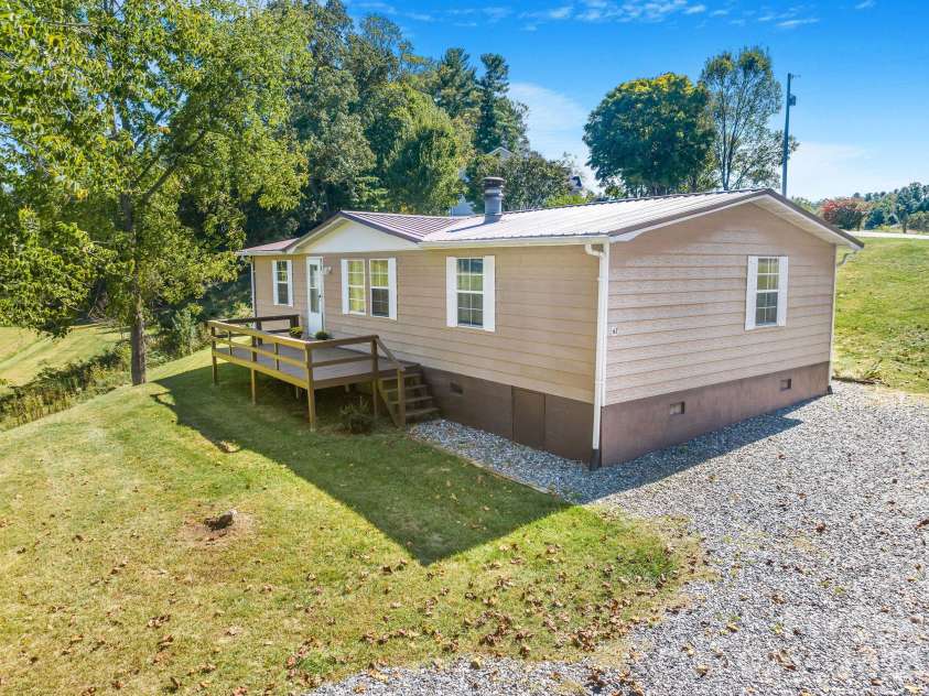 67 & 69 Allman Hill Road, Weaverville, NC 28787.  MLS# CAR4427443, YatesRealty ID 55771. Front view. Deck. Parking!