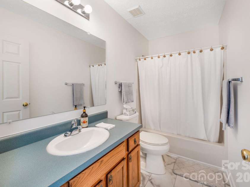 67 & 69 Allman Hill Road, Weaverville, NC 28787.  MLS# CAR4427443, YatesRealty ID 55771. Hall bathroom