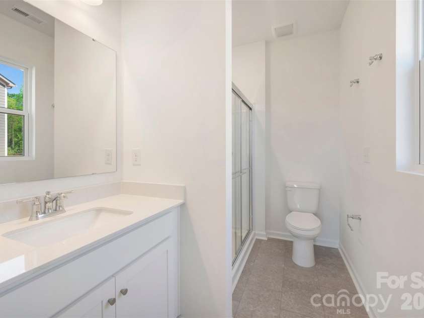211 Amber Glen Drive, Locust, NC 28097.  MLS# CAR4351400, YatesRealty ID 5578. First floor bathroom