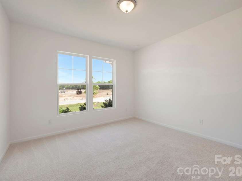 211 Amber Glen Drive, Locust, NC 28097.  MLS# CAR4351400, YatesRealty ID 5578. First floor bedroom