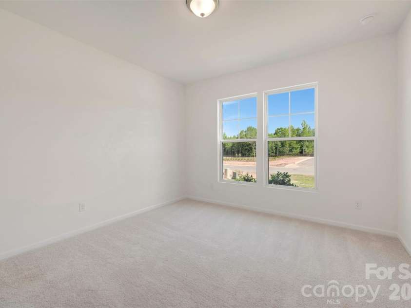 211 Amber Glen Drive, Locust, NC 28097.  MLS# CAR4351400, YatesRealty ID 5578. First floor bedroom