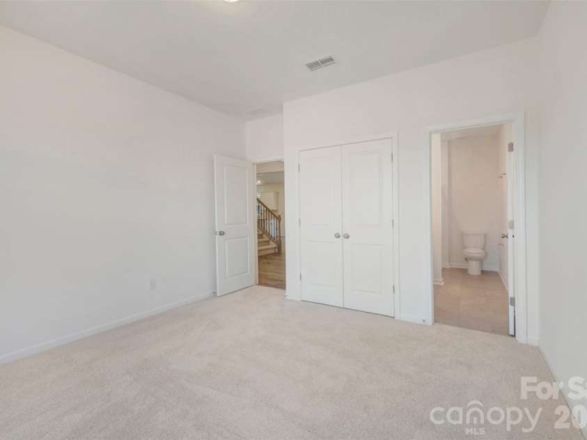211 Amber Glen Drive, Locust, NC 28097.  MLS# CAR4351400, YatesRealty ID 5578. First floor bedroom
