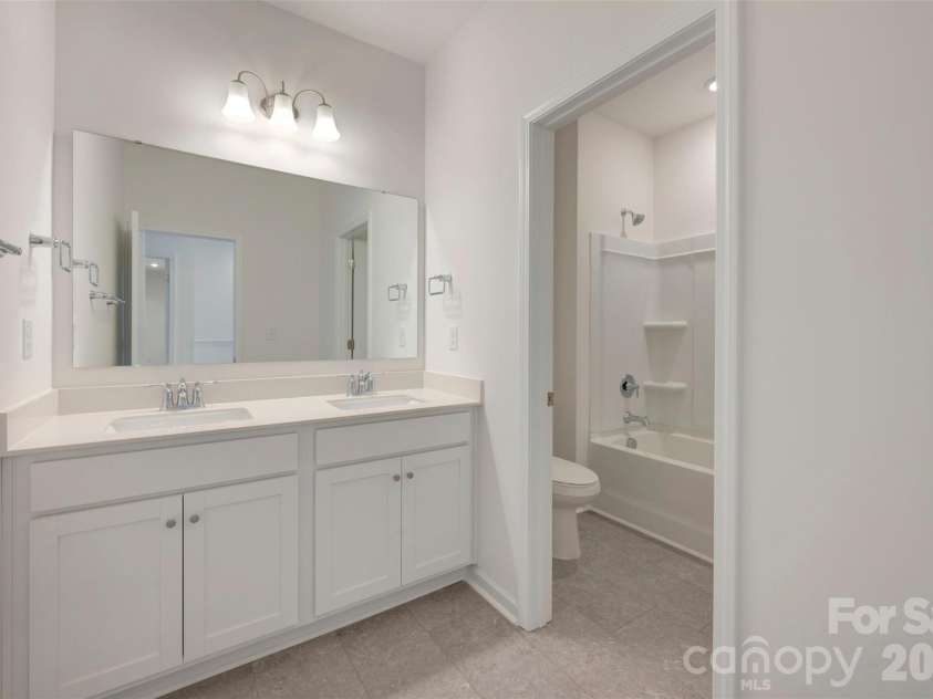 211 Amber Glen Drive, Locust, NC 28097.  MLS# CAR4351400, YatesRealty ID 5578. Secondary bathroom