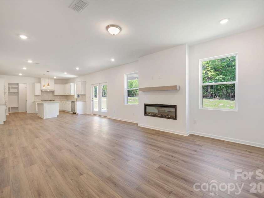 211 Amber Glen Drive, Locust, NC 28217.  MLS# CAR4351400, YatesRealty ID 5578. Family room