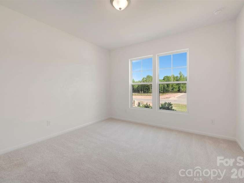 211 Amber Glen Drive, Locust, NC 28217.  MLS# CAR4351400, YatesRealty ID 5578. First floor bedroom