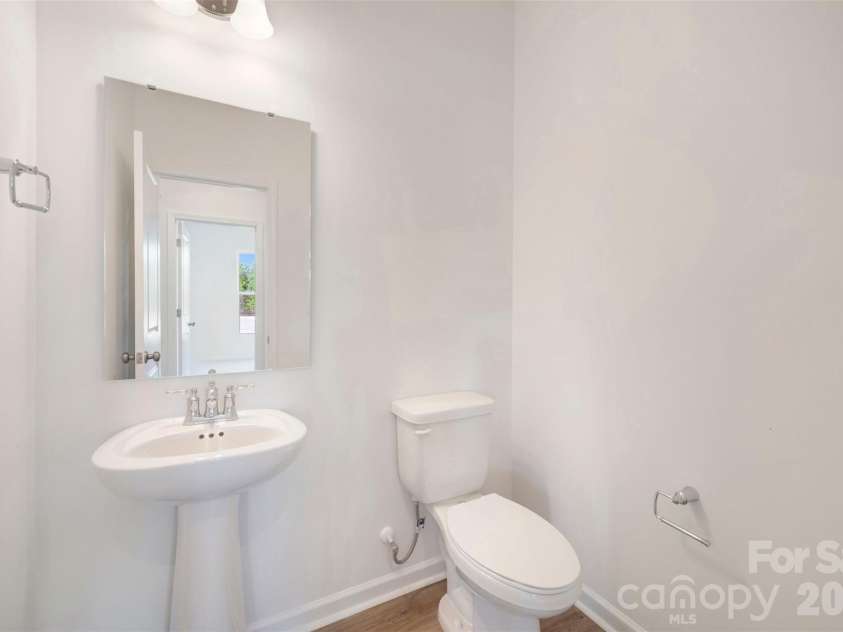 211 Amber Glen Drive, Locust, NC 28217.  MLS# CAR4351400, YatesRealty ID 5578. Powder room