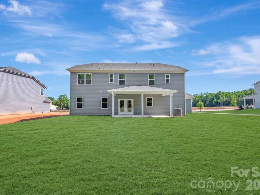 211 Amber Glen Drive, Locust, NC 28217.  MLS# CAR4351400, YatesRealty ID 5578. Rear exterior