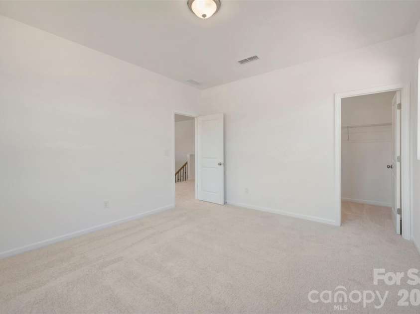211 Amber Glen Drive, Locust, NC 28217.  MLS# CAR4351400, YatesRealty ID 5578. Secondary bedroom