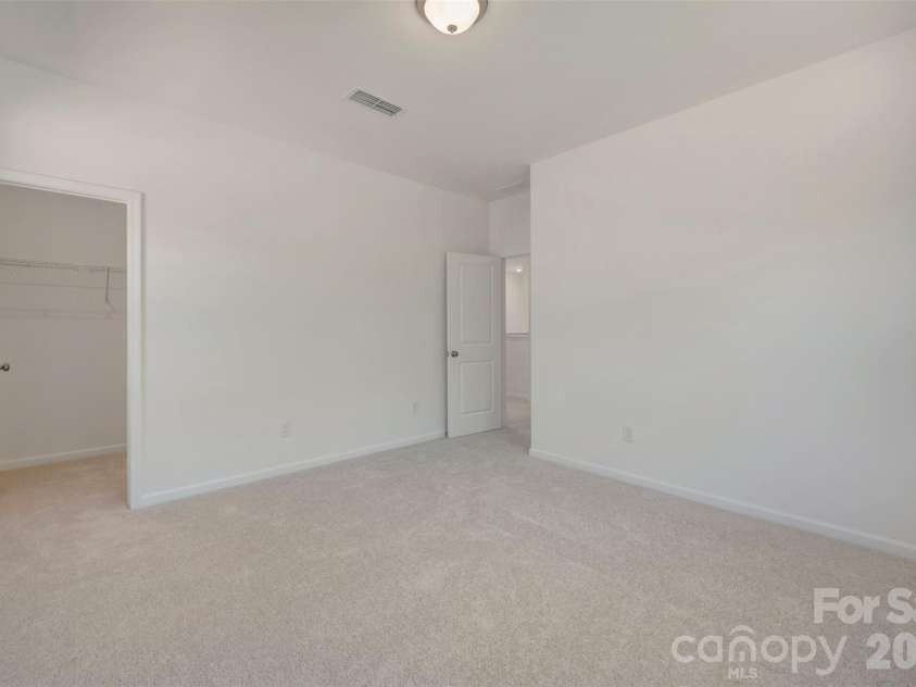 211 Amber Glen Drive, Locust, NC 28217.  MLS# CAR4351400, YatesRealty ID 5578. Secondary bedroom