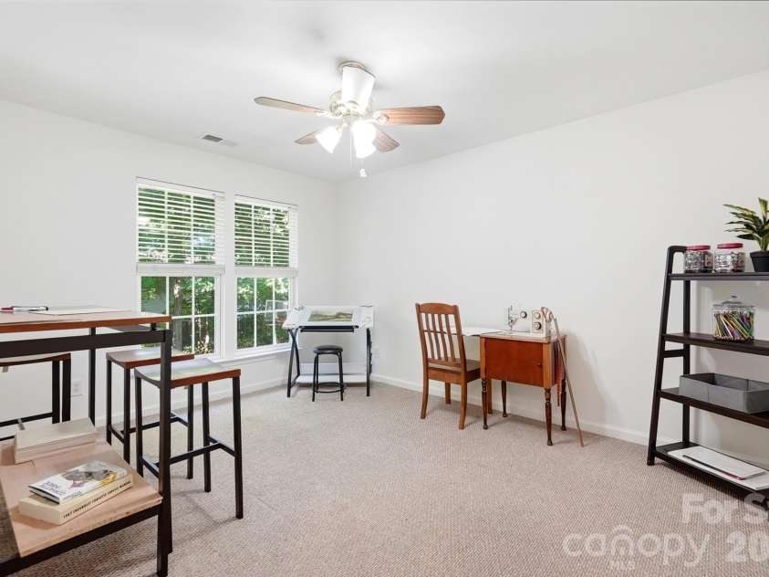 2100 Pineapple Court, Matthews, NC 28105.  MLS# CAR4431286, YatesRealty ID 55807. Bedroom 2 craft room now