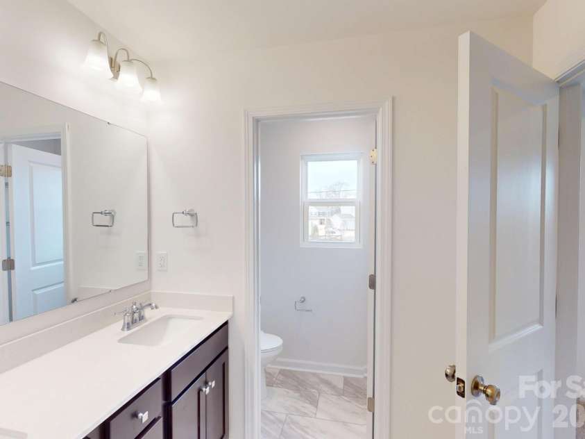 1022 Overbrook Place, Wingate, NC 28174.  MLS# CAR4355301, YatesRealty ID 5581. Owner's bathroom