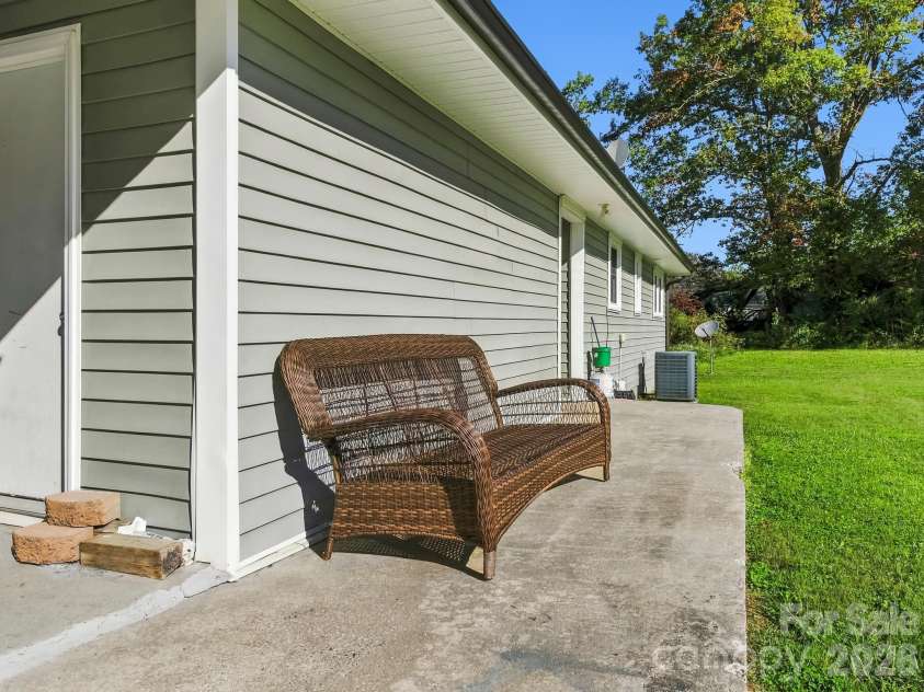 17 Randolph Avenue, Flat Rock, NC 28731.  MLS# CAR4428296, YatesRealty ID 55829. Back Patio on Duplex on Randolph Ave